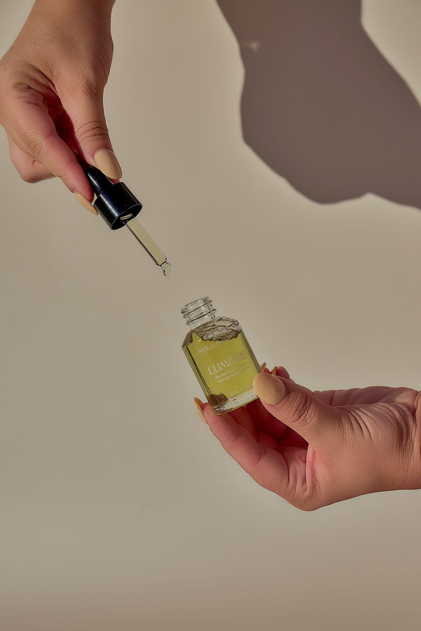 Lumiere face oil model shot